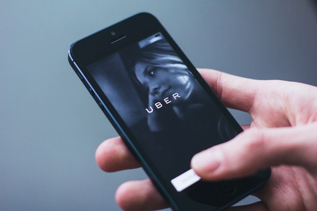 Collaboration is the New Leadership image with Uber phone
